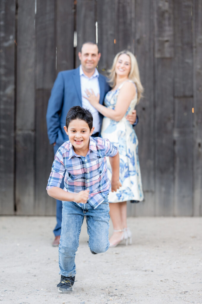 Son running at family photo shoot at West 12 Ranch with Gia Chong Photography, Lodi CA photographer