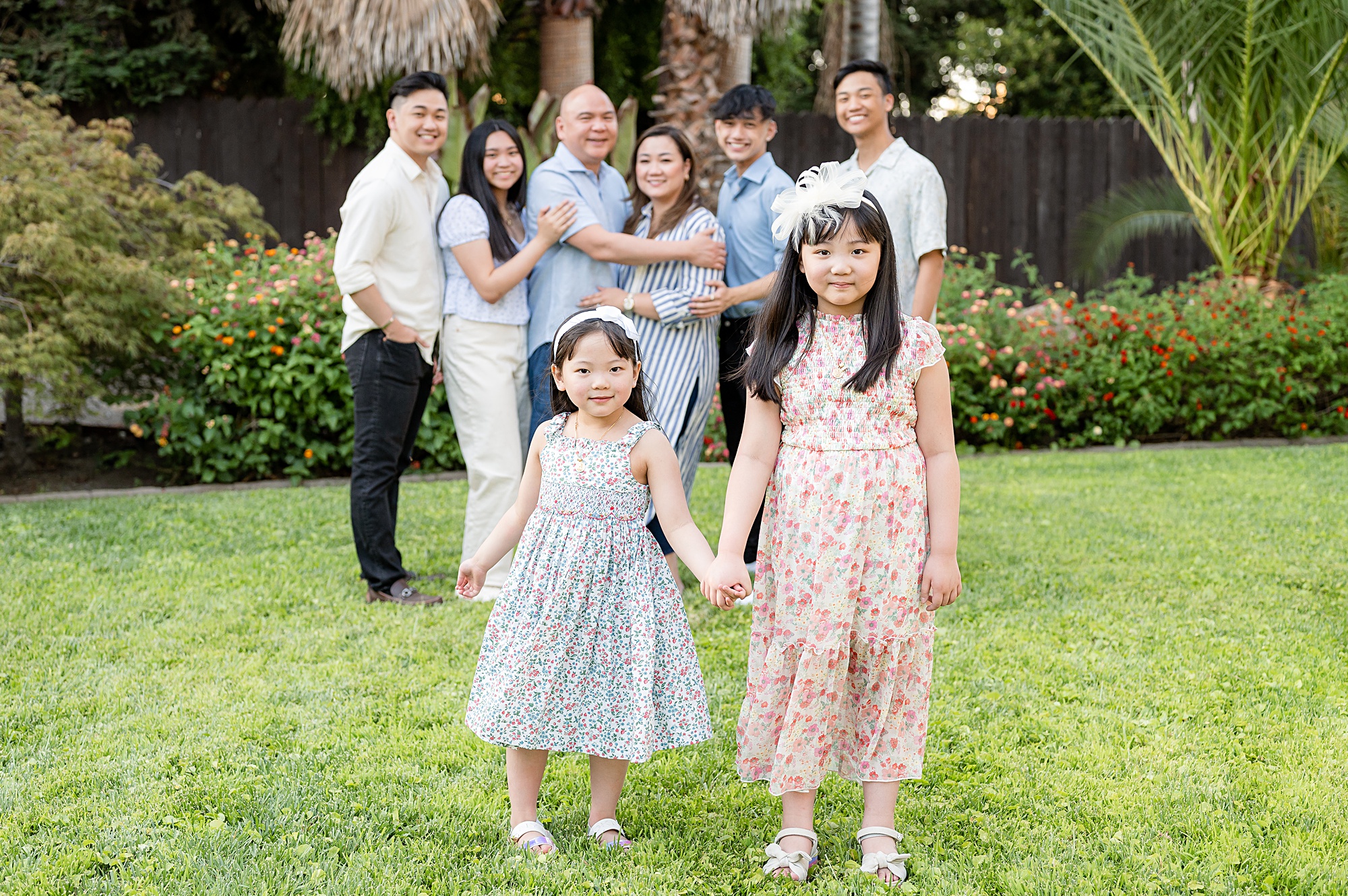 Sisters holding hands posing idea