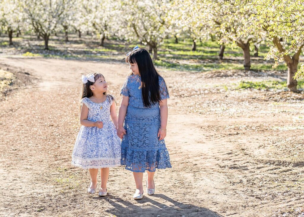 Little girls walking pose idea almond blossoms photo session