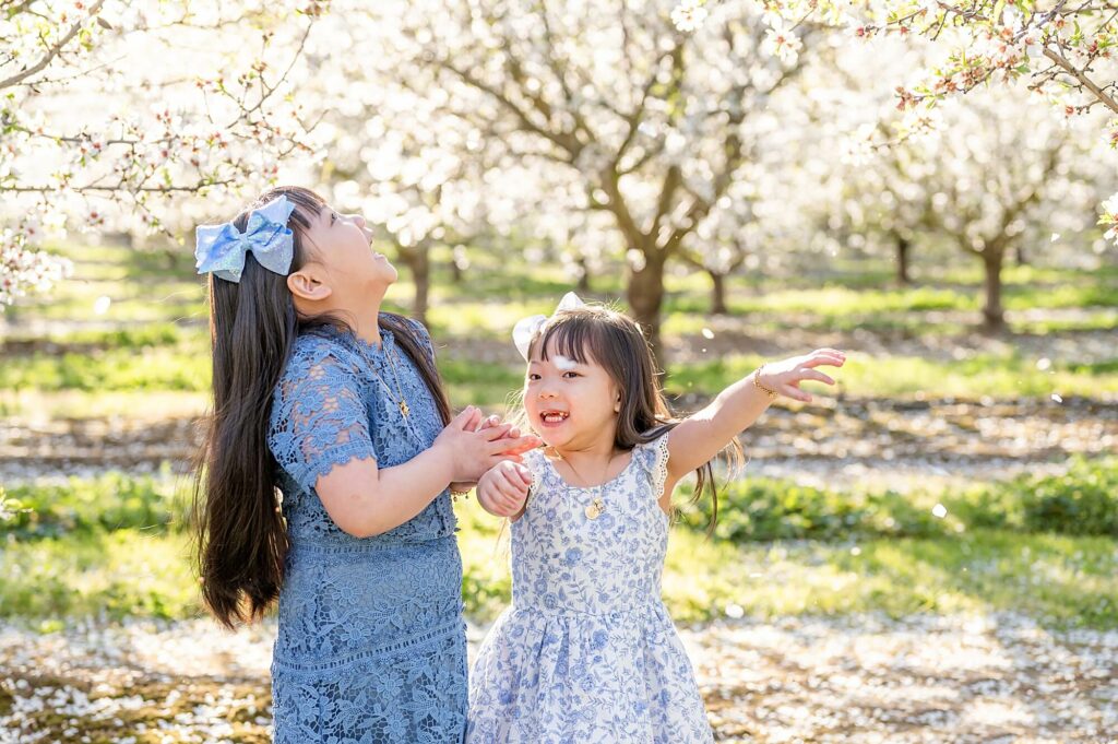 Girls playing with petals pose idea 