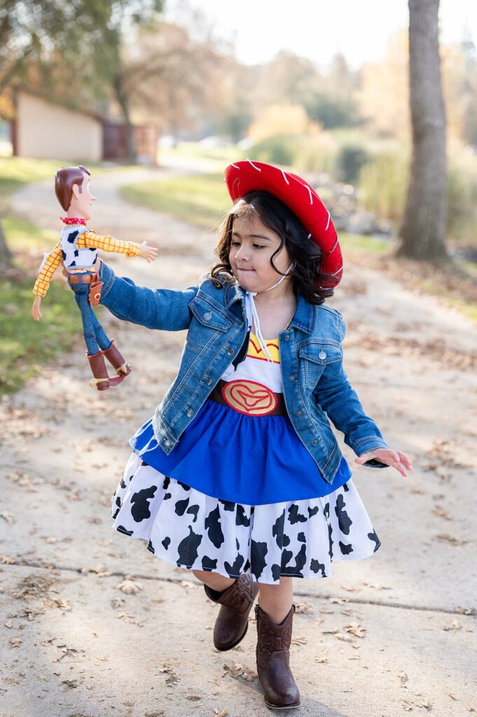 Little cowgirl with Woody posing