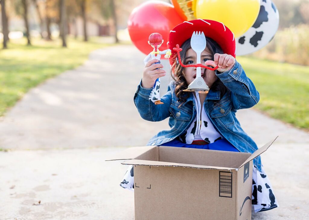 Little girl with Forky pose during toy story inspired photo shoot