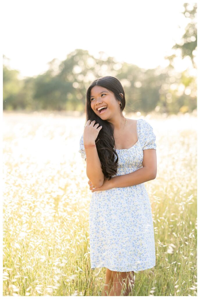 teenager laughing pose idea during outdoor family photo session