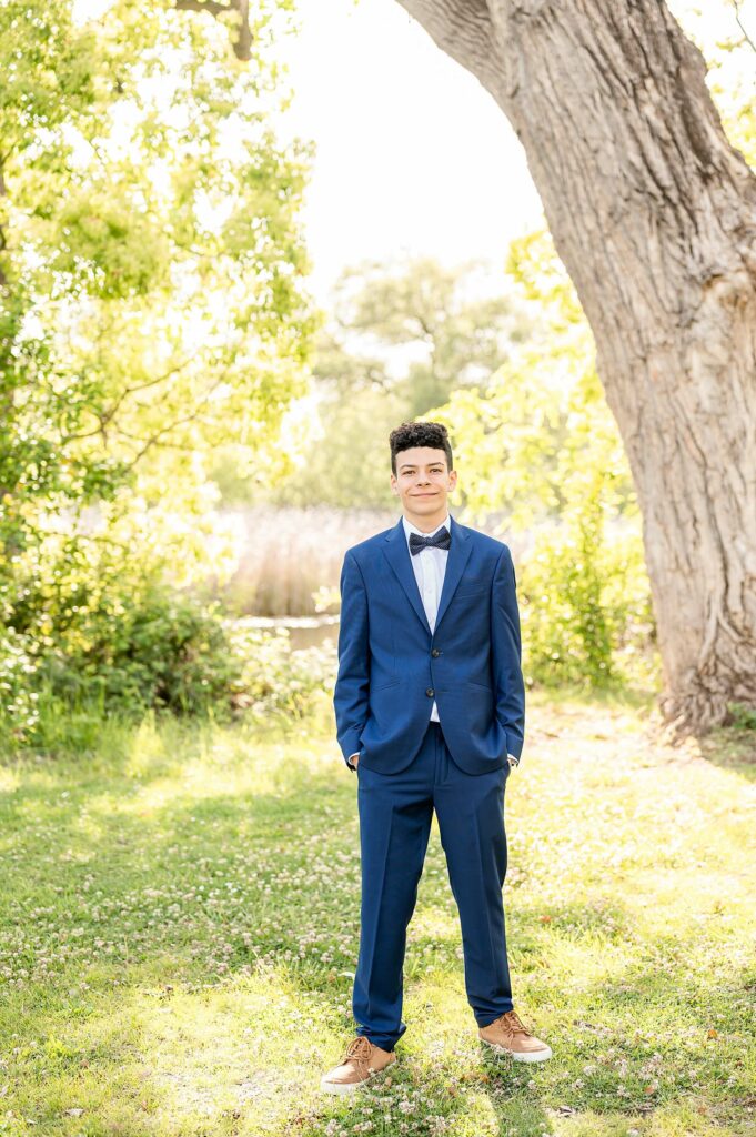 8th grade boy in a suit posing idea