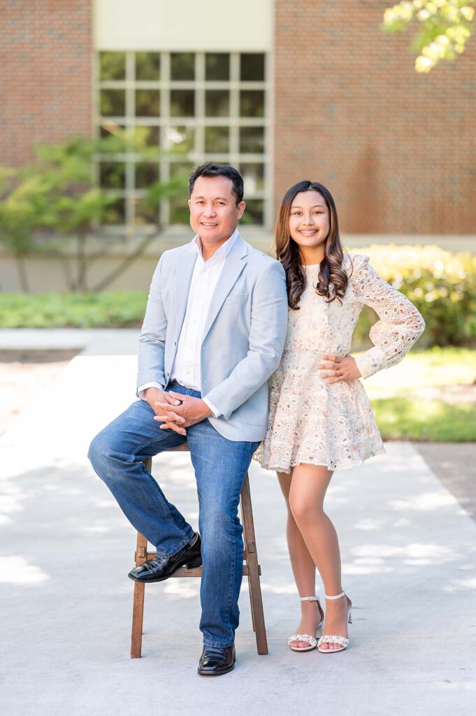 dad and graduating girl during a grad session with Gia Chong Photographyt