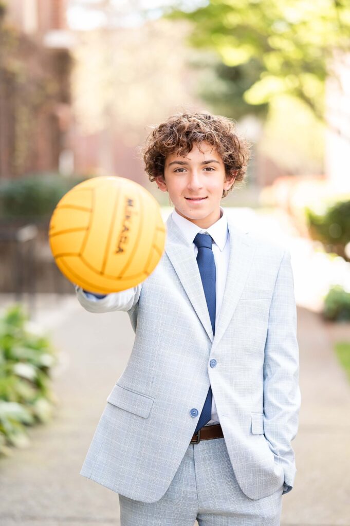 graduation prop idea, grad using his waterpolo ball during his grad session