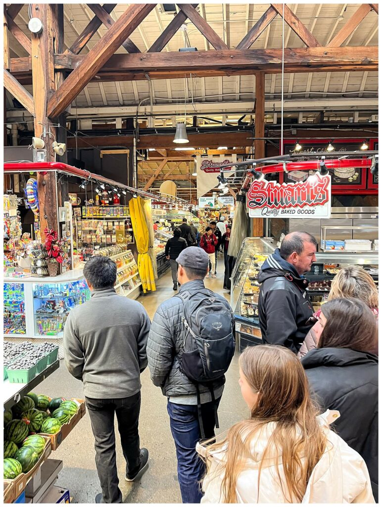 father and son exploring Granville Public Market in Vancouver BC