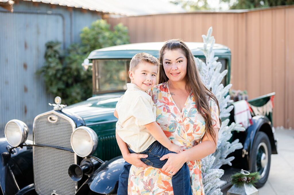 Mom and son hugging during a Vintage Truck Christmas Mini Session near Lodi CA