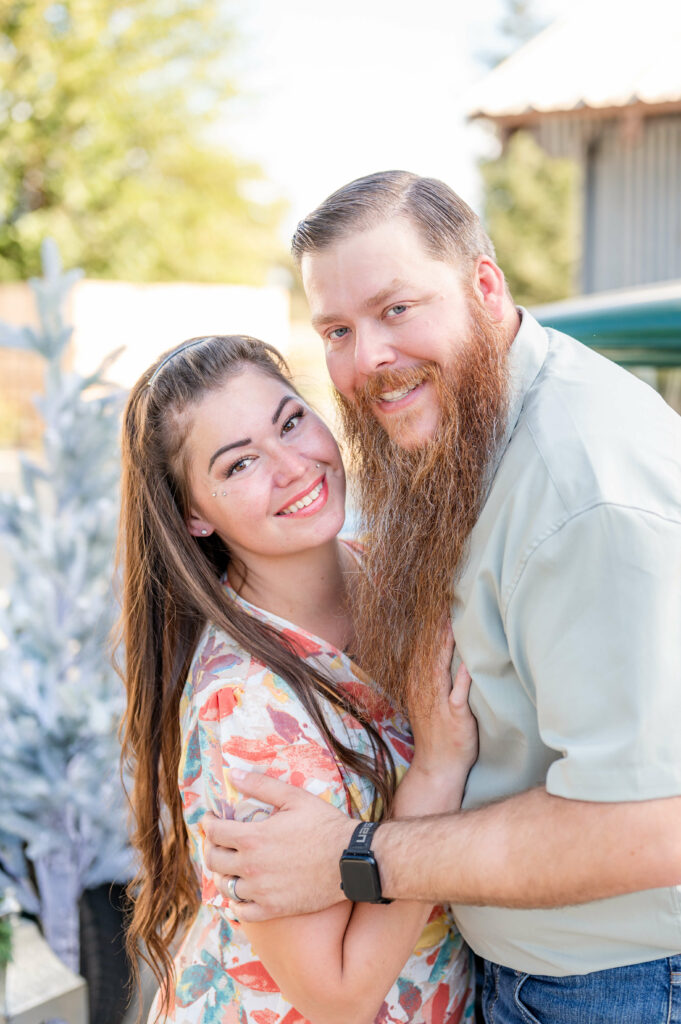 Couple hugging pose idea during a Vintage Truck Christmas Mini Session