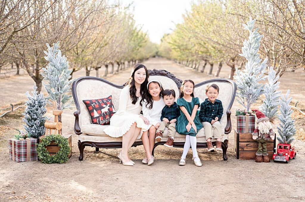 Mom and kids on Christmas couch at Golden R Ranch Stockton CA