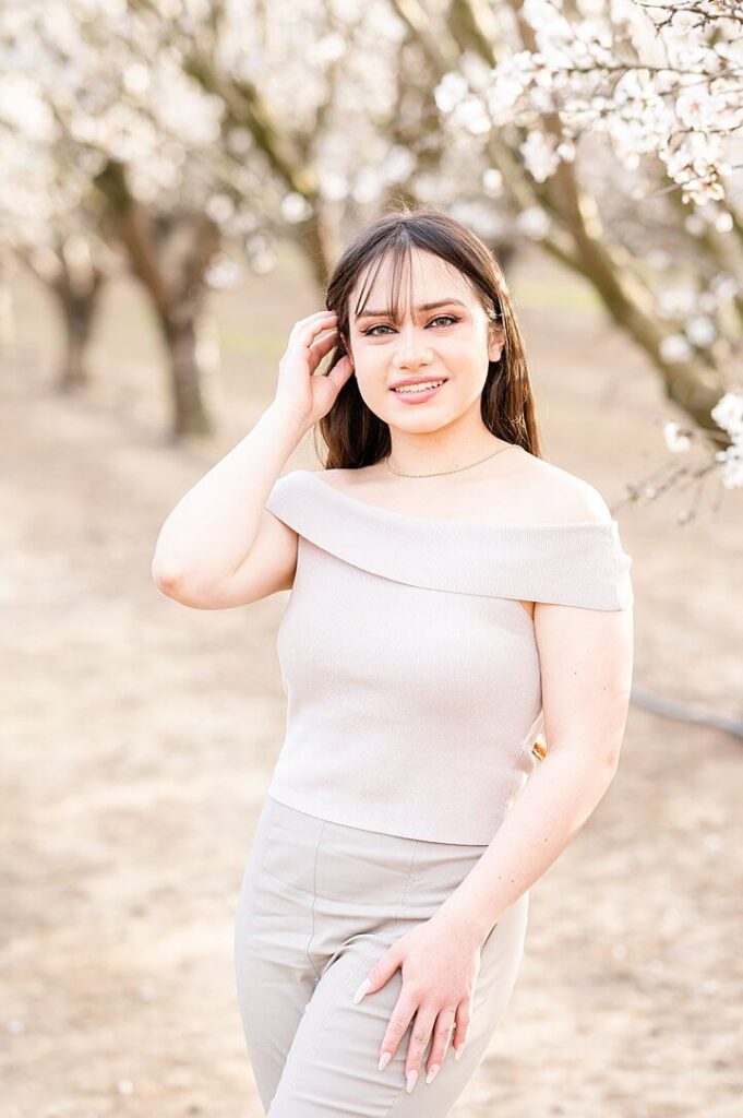 senior girl standing and smiling pose during grad session