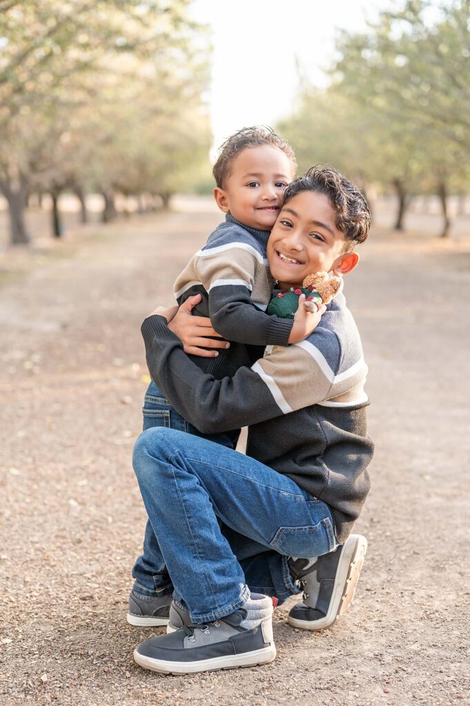 Brothers hugging during their family session at Golden R in Stockton CA